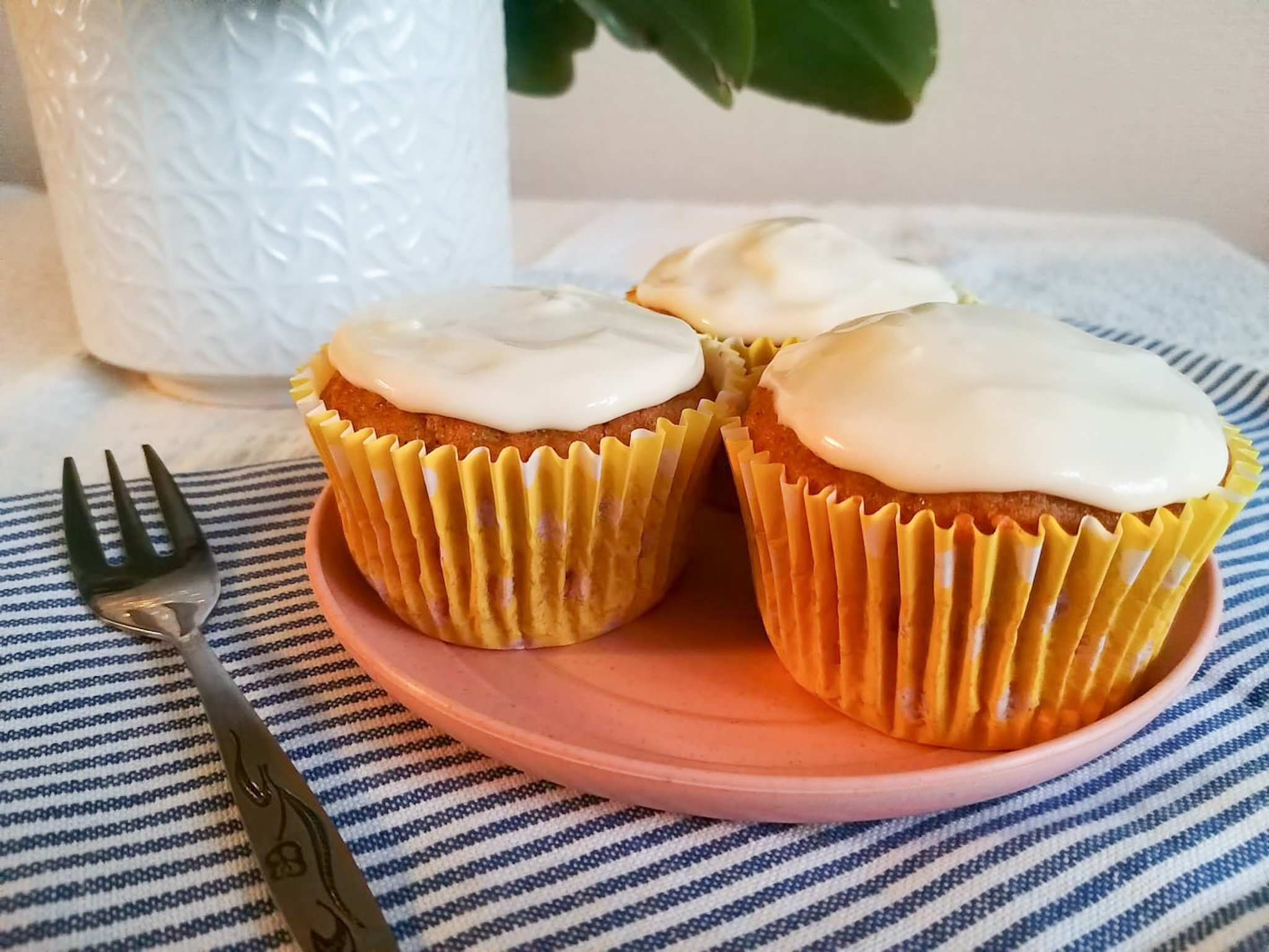 gluten free carrot cake muffins with walnuts, sultanas or raisins and cinnamon - topped with a simple vanilla icing